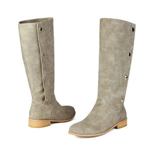 Cowboyboots i mockalook med knappar och bred skaftöppning