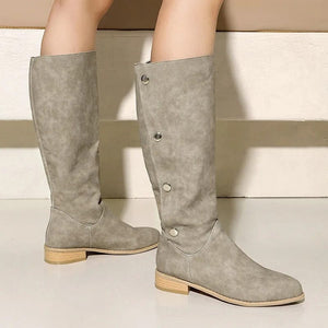 Cowboyboots i mockalook med knappar och bred skaftöppning