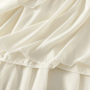 Midikjol med asymmetrisk drapering