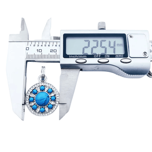 Rund silverberlock med turkos och strass Silver med turkos