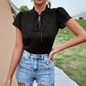 Svart blus med rosett