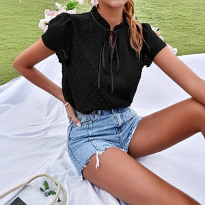Svart blus med rosett