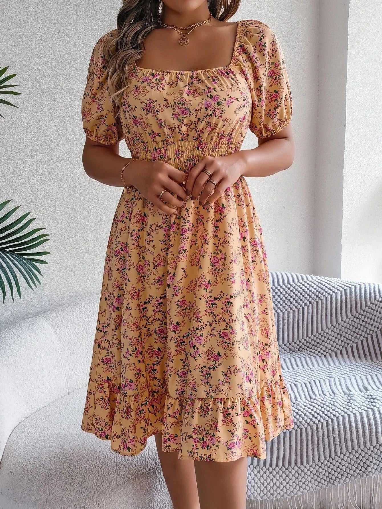 Blommig off-shoulder midiklänning