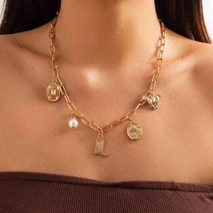 Chunky guldhalsband och armband med western-berlocker