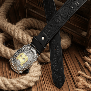 Cowboybälte med gyllene bokstav