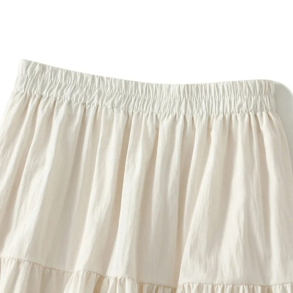 Lång kjol med volanger och spetsdetaljer