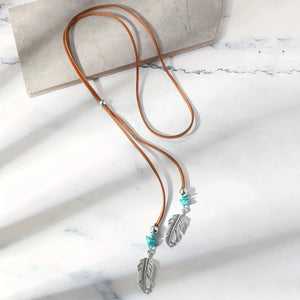 Lariat-halsband i mocka med fjädrar och turkos Brun med turkos