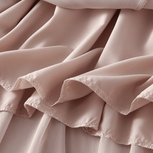 Midikjol med asymmetrisk drapering
