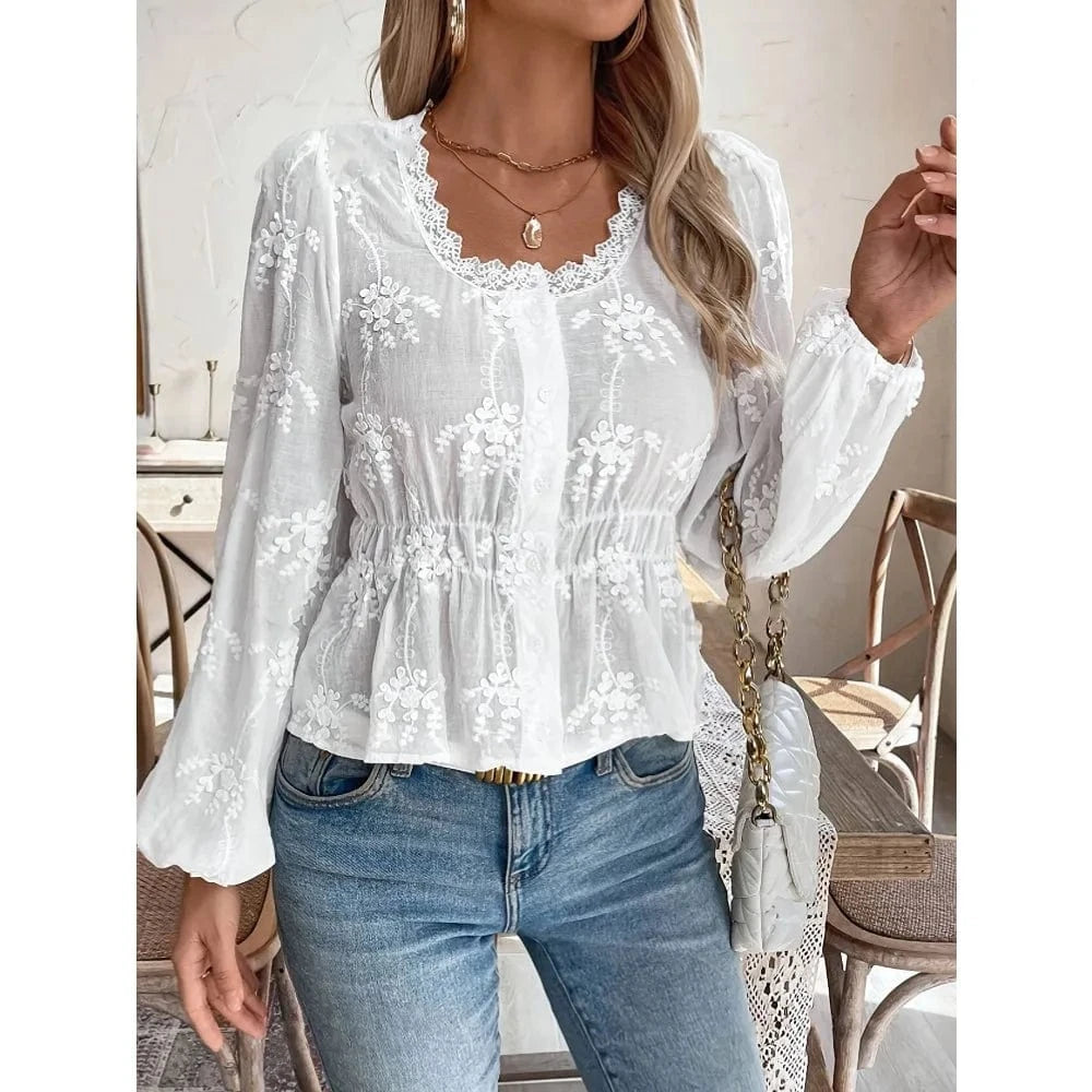 Vit broderad blus i broderie anglaise med ballongärm